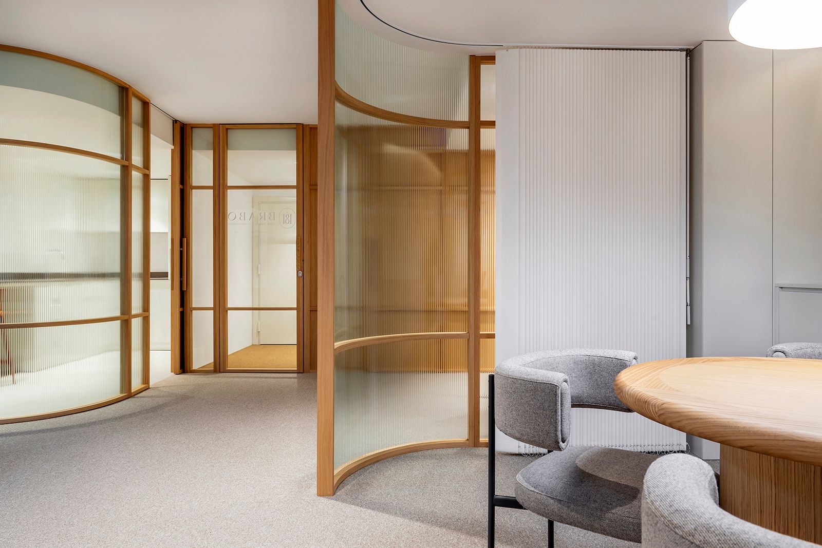 Modern meeting room with curved glass partitions