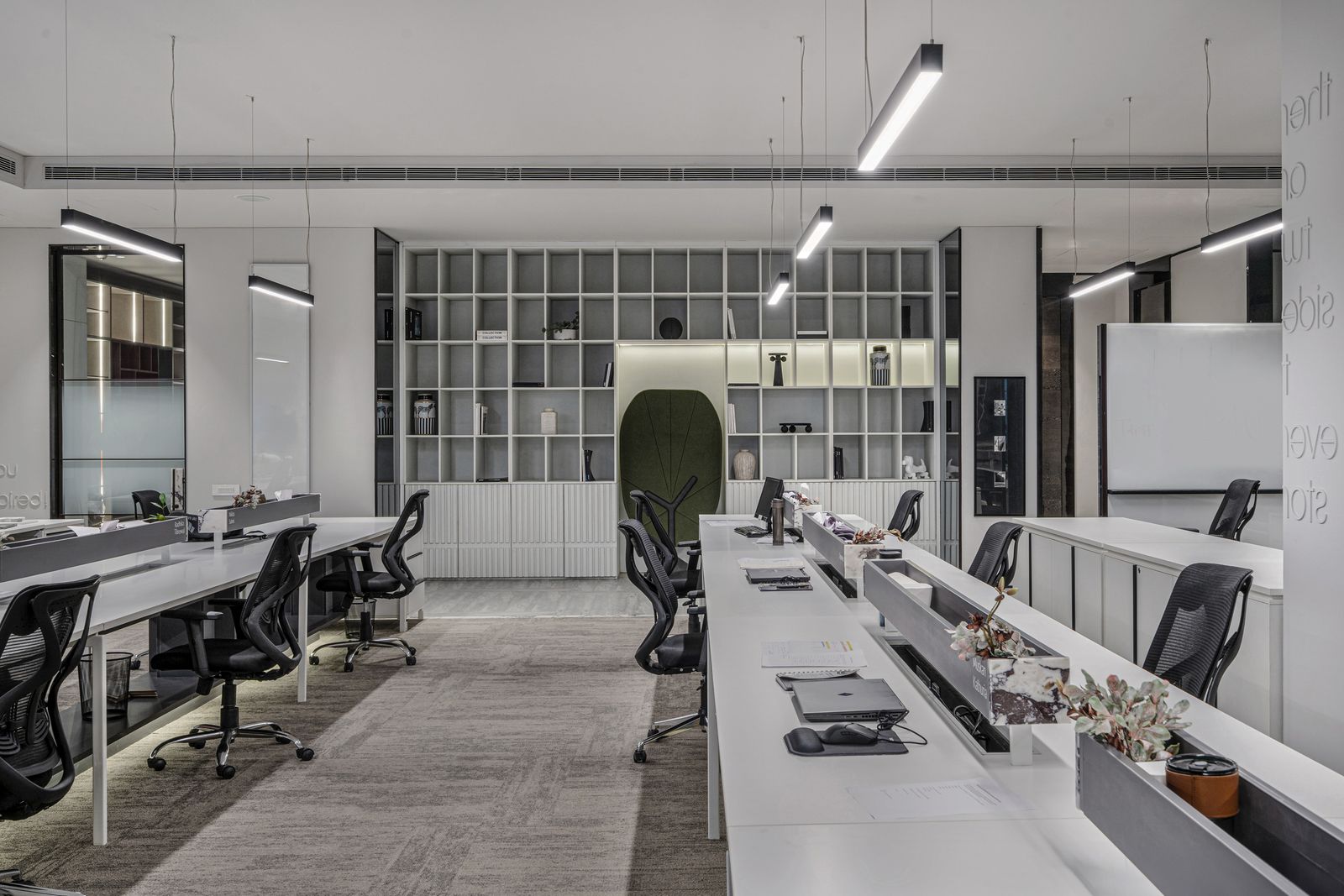 Minimal office interior with linear lights and open workstations